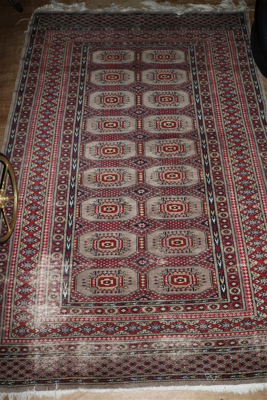 Red patterned Bokhara rug